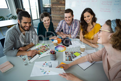 Graphic designers discussing with each other in meeting