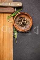 Wooden board and bowl of spices