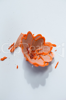 Blue color pencil shavings in a flower shape on a white background