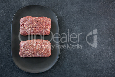 Minced beef in black plate