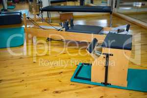 Reformer and wunda chair on wooden floor