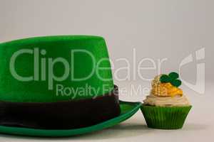 St Patricks Day leprechaun hat with shamrock on cupcake