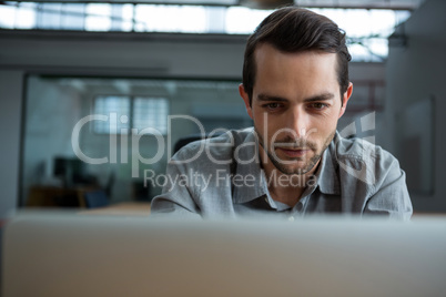 Happy man working on laptop