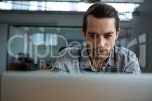 Happy man working on laptop