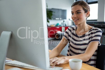 Female graphic designer working on computer