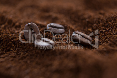 Coffee beans on roasted coffee heap