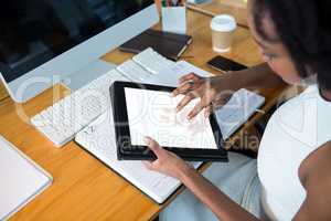 Female graphic designer using digital tablet