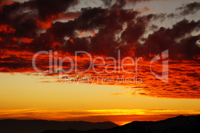 Colorful fiery sunset over the mountains