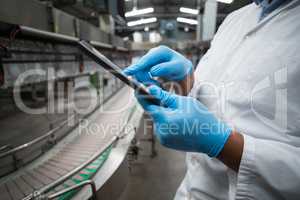 Factory engineer using digital tablet in the factory