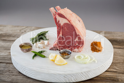 Rib chop and ingredients on white board