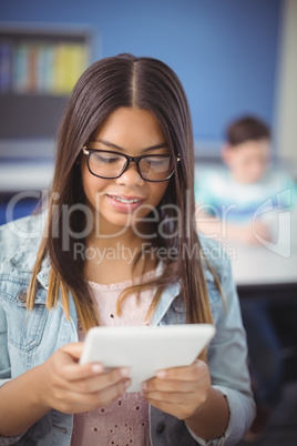 Student using digital tablet in classroom