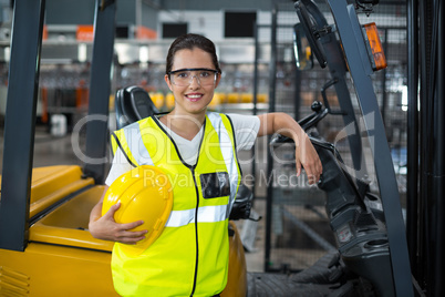 Portrait of female worker standing in factory Portrait of female worker standing in factory