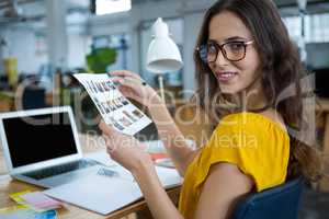 Female graphic designer working at desk