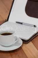 Black coffee with organizer and pen