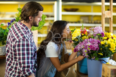 Couple purchasing flowers at florist shop