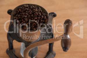 Vintage coffee grinder with coffee beans