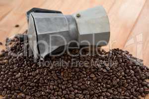 Coffee beans with metallic coffeemaker