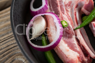 Blade chop and chopped chillies and onions in frying pan