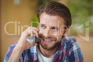 Close-up of male executive talking on mobile phone