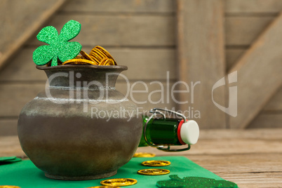 St. Patricks Day shamrock, beer bottle and pot filled with chocolate gold coins