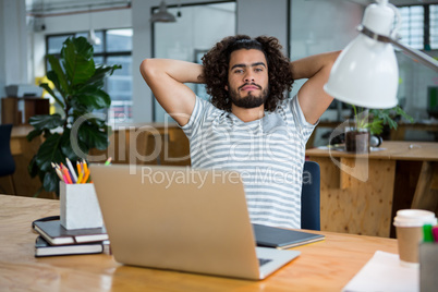 Graphic designer relaxing on chair