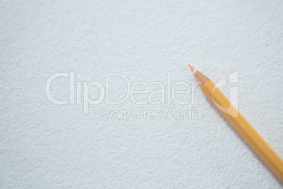 Peach color pencil on white background