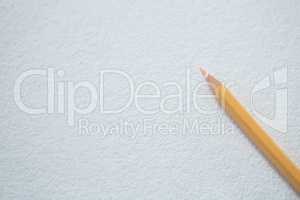 Peach color pencil on white background