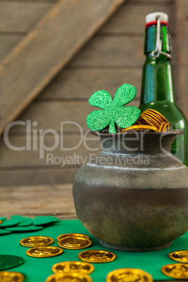 St. Patricks Day shamrock, beer bottle and pot filled with chocolate gold coins