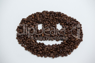 Coffee beans forming smiley face