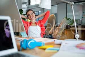 Female graphic designer relaxing on chair