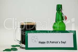 Mug of black beer and shamrock for St Patricks Day