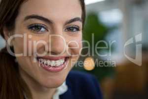 Smiling female executive in creative office