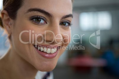 Smiling female executive in creative office