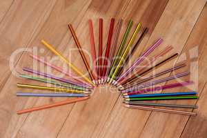 Colored pencils arranged in a semi-circle