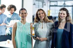 Portrait of smiling business executives at meeting