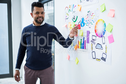 Graphic designer giving presentation in creative office