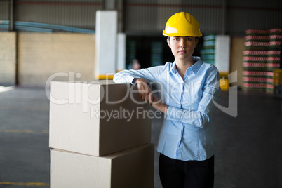 Portrait of female worker standing in factory