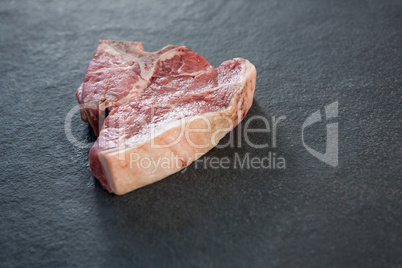 Sirloin chop against black background