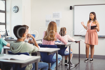 Schoolgirl giving presentation in classroom