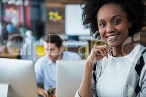 Happy woman standing in office