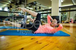 Portrait of fit women performing stretching exercise