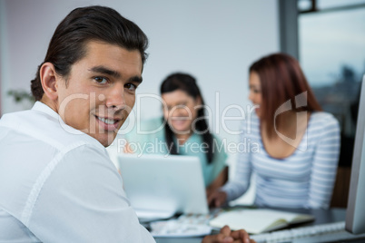 Handsome man sitting in office