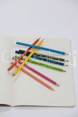 Colored pencils and notebook