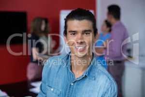 Portrait of smiling business executive at meeting