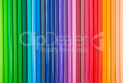 Close-up of colored pencil arranged in a row