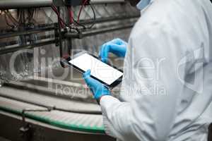 Factory engineer using digital tablet in the factory