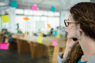 Female executive talking on mobile phone