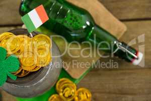 St. Patricks Day shamrock, flag, beer bottle and pot filled with chocolate gold coins