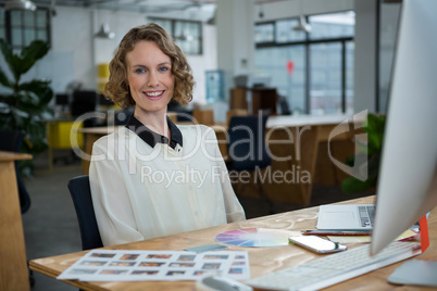 Female graphic designer working at desk