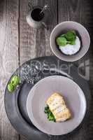 Fried cod fillets and spinach